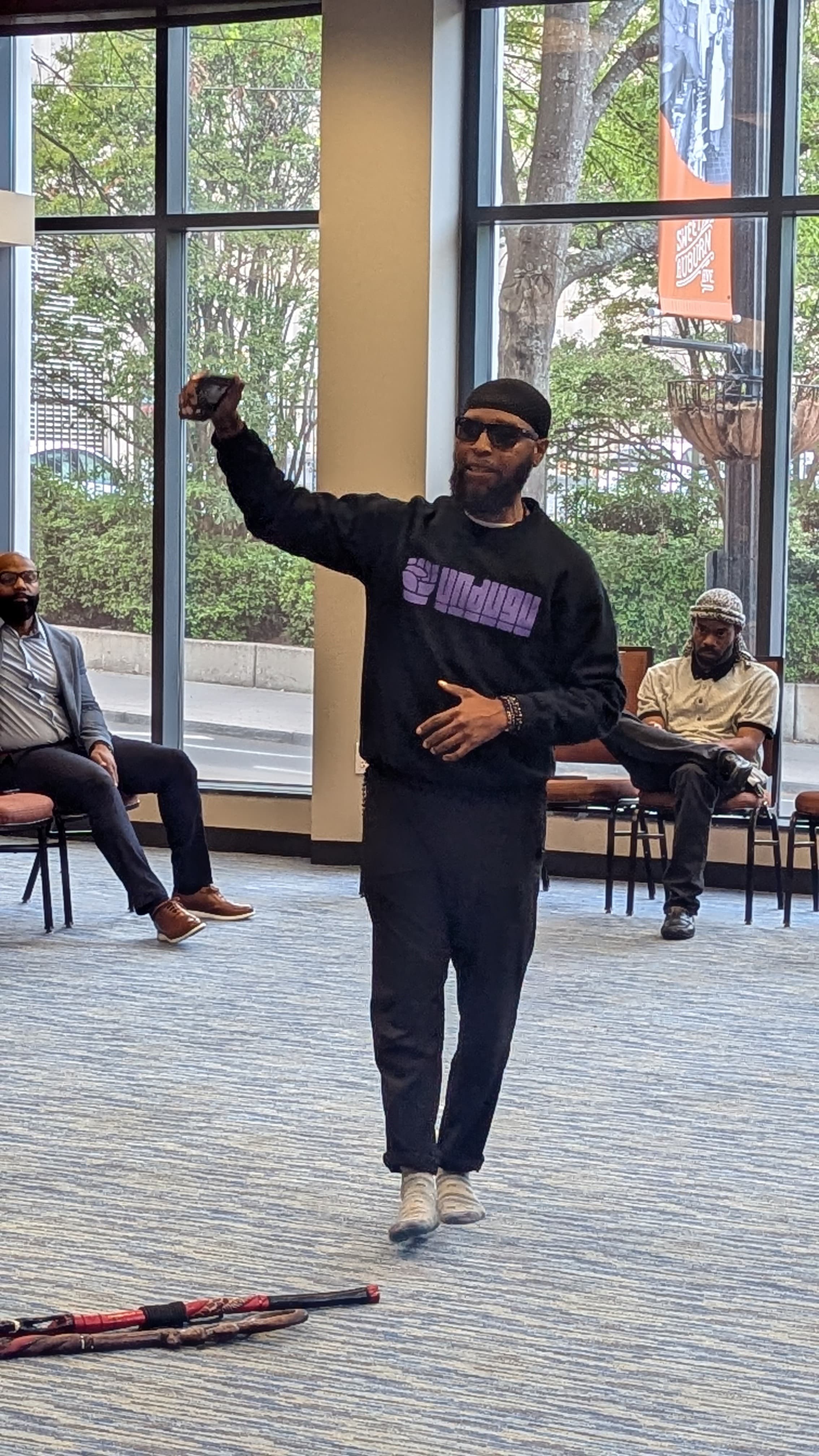 An Undugu elder addressing the room at Chop-It-Up